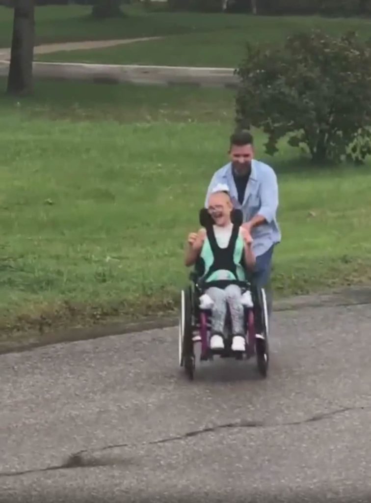 Dad Pushes Daughter In Wheelchair Through Puddles Faithpot 7440