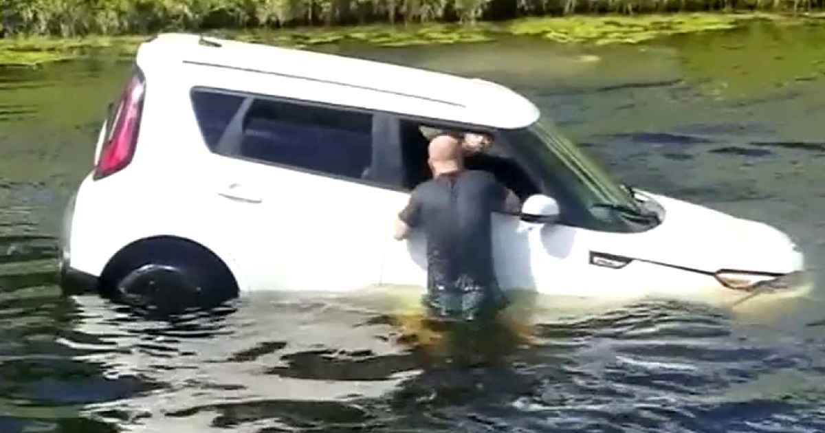 man-saves-woman-from-sinking-car