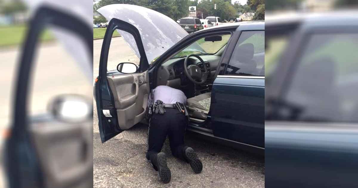 police-officer-helps-fix-car