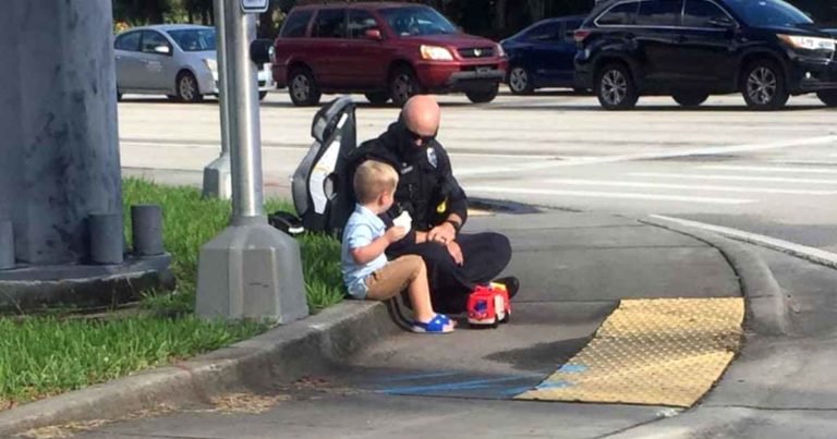 police-officer-comforts-toddler-after-accident