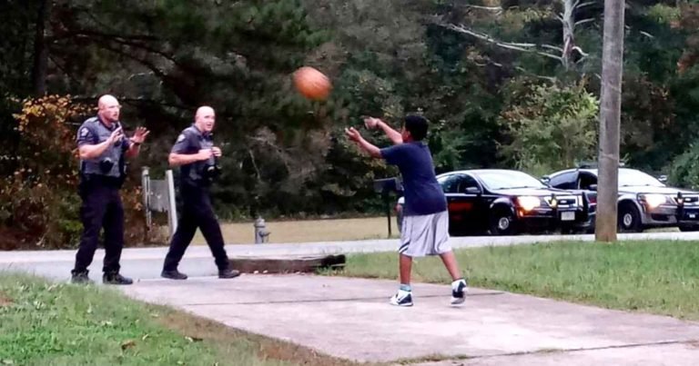 police-officers-play-basketball-with-kid