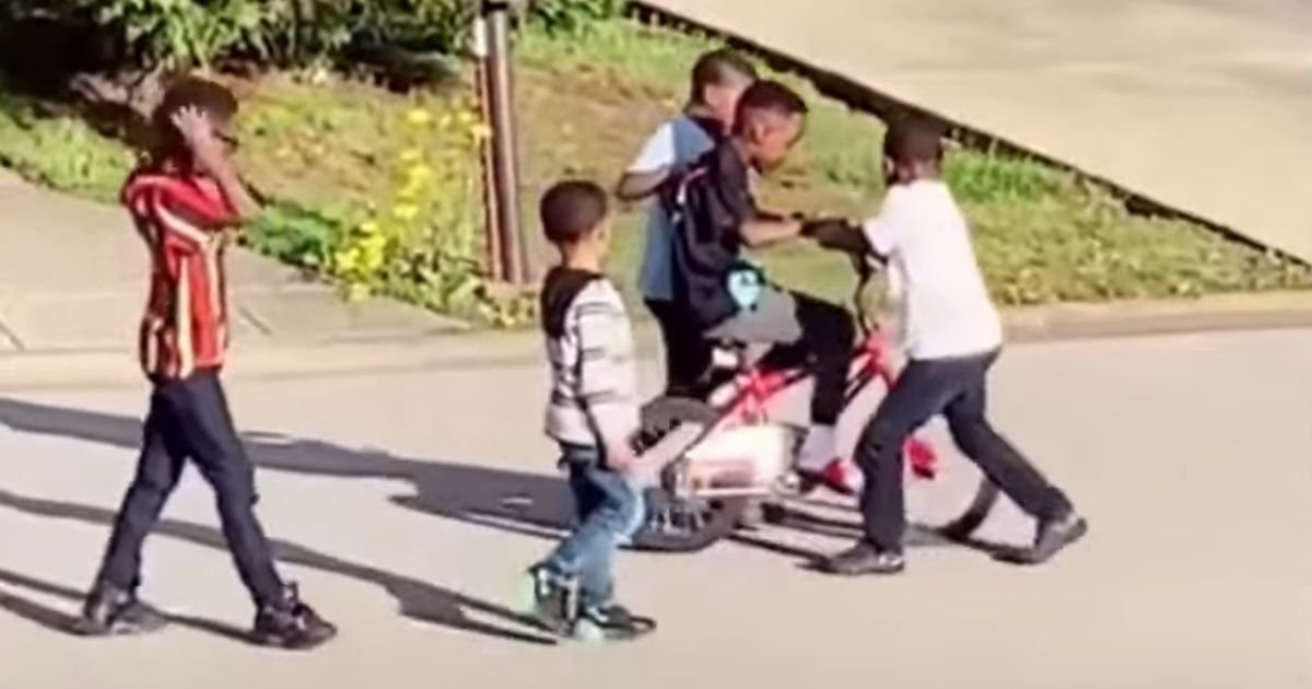 kids-help-boy-ride-bike