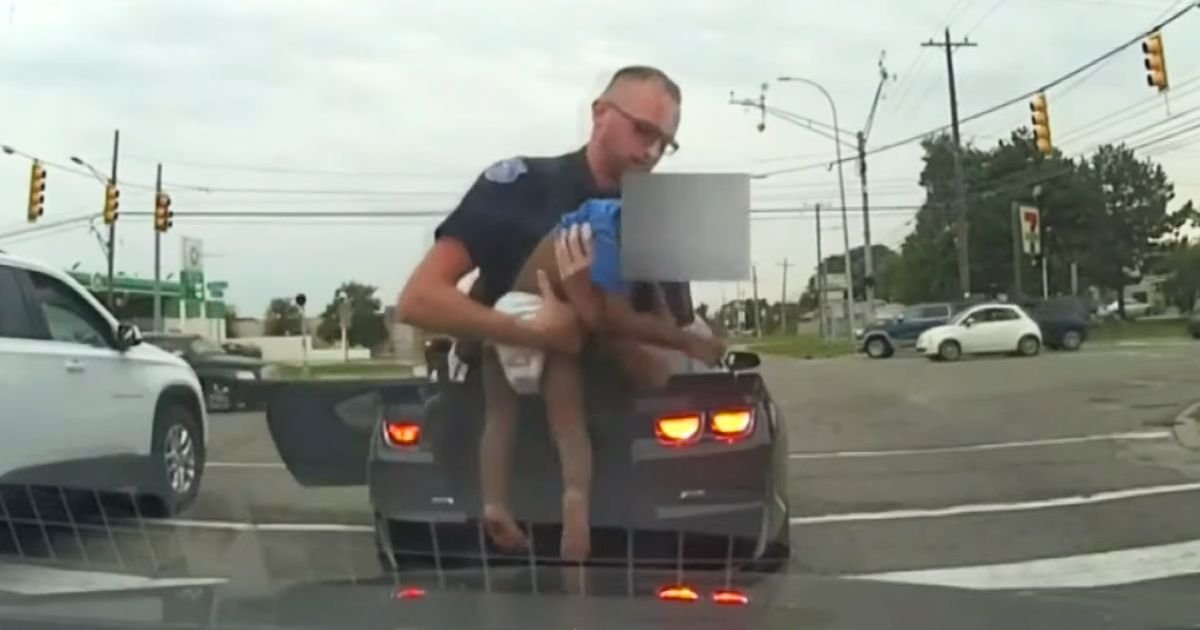 police officer saves choking baby michigan