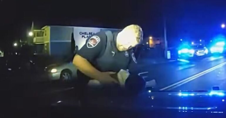 police officer crying after saving baby