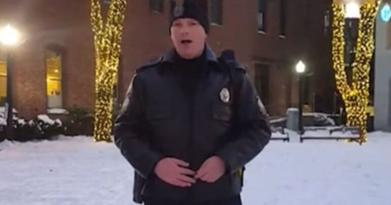 Police officer sings O Holy Night